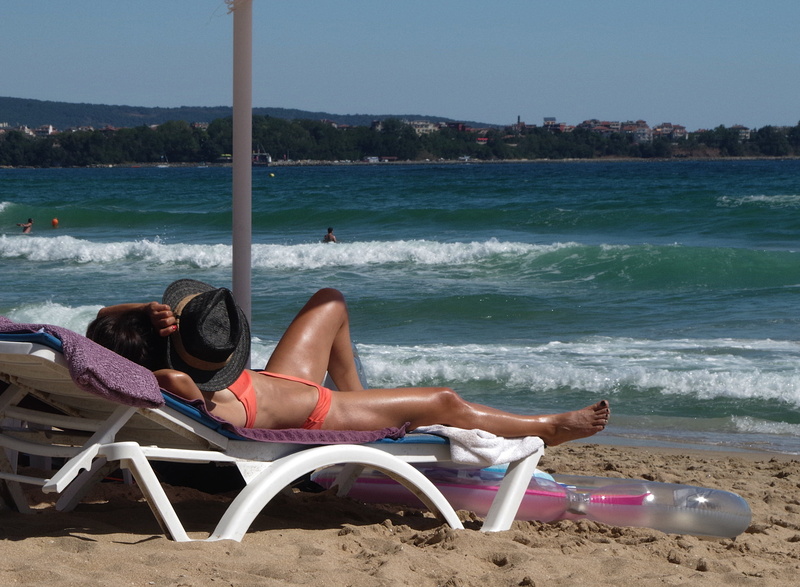 sunbed, land, relaxation, sunny, holiday, tanning, leisure activity, beautiful woman, sea, women, vacations, chair, sitting, beach, lifestyles, real people