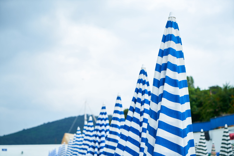 out, nature, blue, travel, sky, copy space, composition, cloud, pattern, outdoors, umbrella, city, building exterior, flag, mountain, white, striped, pool