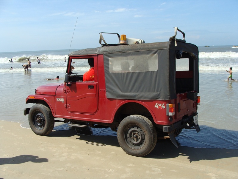 water, horizon, incidental people, goa, safety, mode of transportation, vehicle, group of people, jeep, transportation, sky, horizon over water, van, arabian
