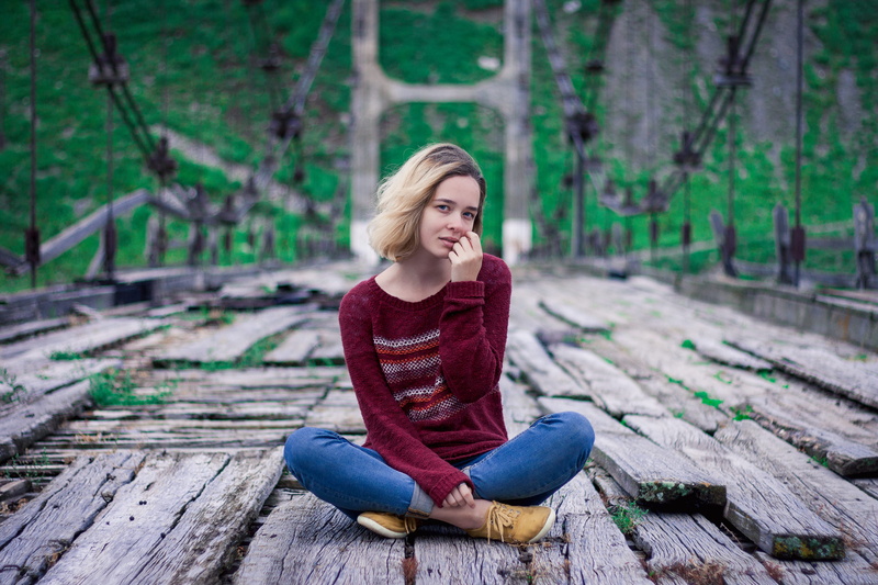 girl, pants, one person, footwear, casual clothing, clothing, wood, hair, path, female, full length, person, child, cross-legged, 4K, outdoors, young women