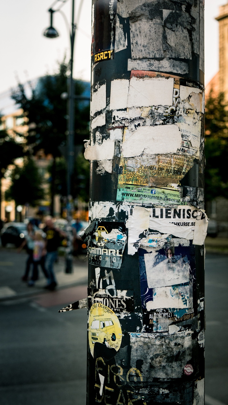 outdoors, focus on foreground, street, tree trunk, delivery, incidental people, pole, plant, alexanderplatz, sign, nature, antennas, transportation, 4K
