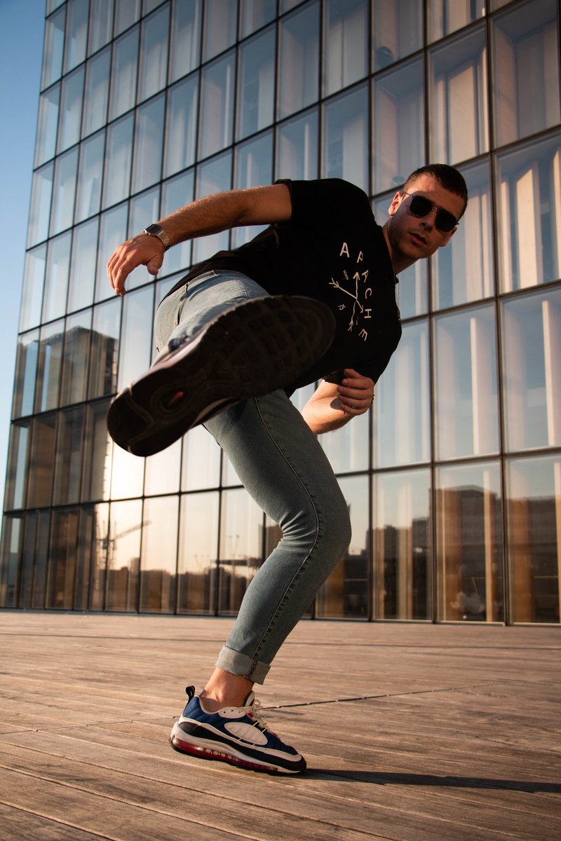 vitality, fight, young adult, office building exterior, skill, parisian, leisure activity, day, airmax, lifestyle, balance, modern, built structure, young men