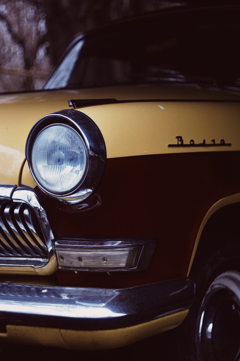 land vehicle, photoghraphy, black, lighting equipment, automobile, retro styled, car light, indoors, closeup, vehicle, metal, luxury, focus on foreground