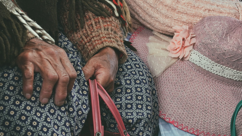 midsection, senior women, sitting, real people, casual clothing, holding, warm clothing, high angle view, hands, people, copacabana, bolivia, 2K, women