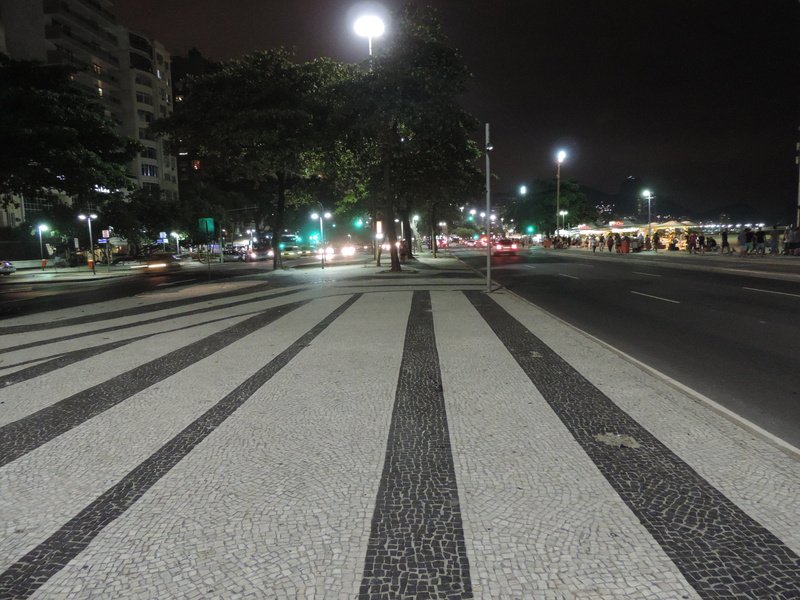 architecture, symbol, street light, copacabana, built structure, nature, city, sign, city street, rio de janeiro vacation, illuminated, car, surface level