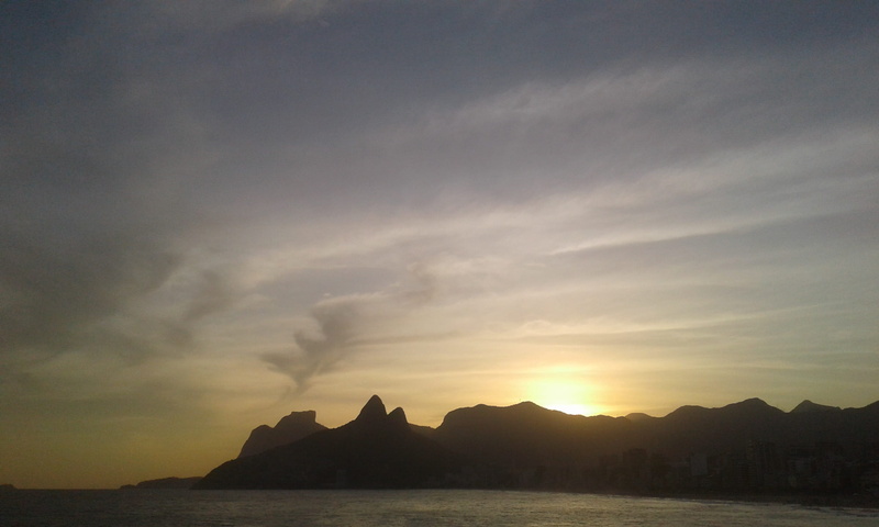 land, mountain range, idyllic, beauty in nature, sky, water, sunset, no people, rock, non-urban scene, outdoors, tranquility, mountain, cloud - sky, copacabana