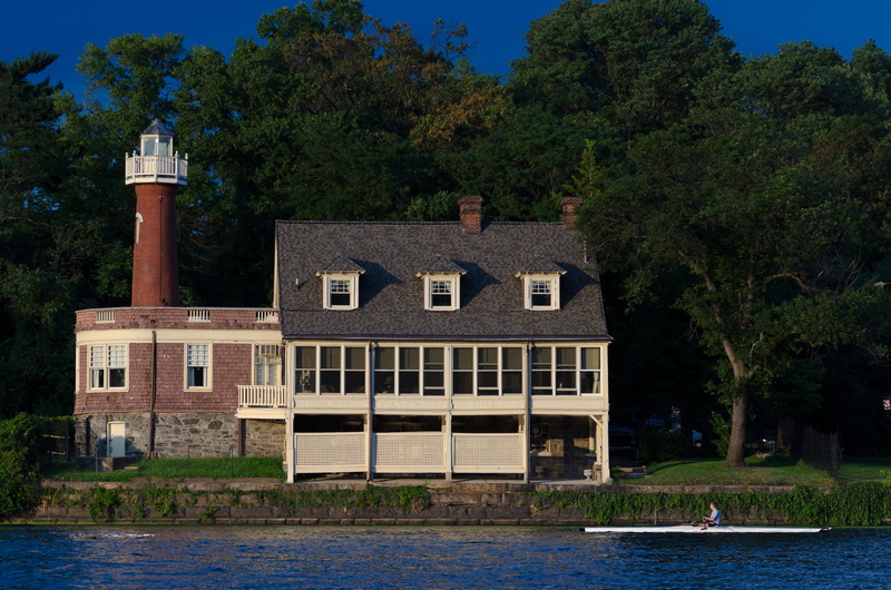 tree, outdoors, water, light house, architecture, growth, day, waterfront, boathouse row, residential district, built structure, people, river, nature