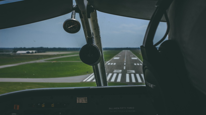 windshield, cockpit, bose, landing, dials, day, glass - material, landscape, runway, air vehicle, person, airport, no people, mode of transportation, nature