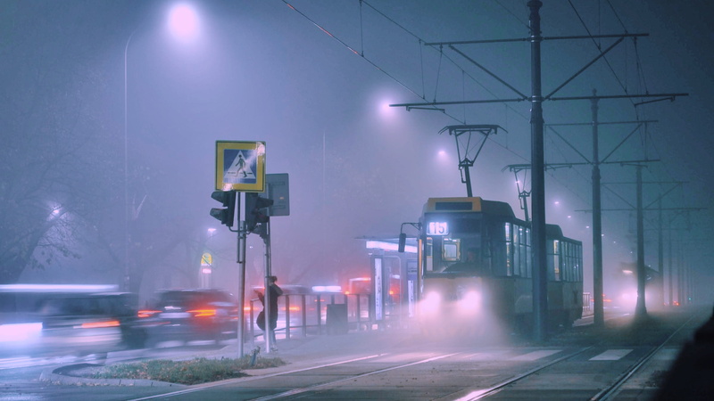sign, urban, street light, electric, tram, outdoors, railroad track, road, land vehicle, sky, blurred motion, warsaw, 2K, motor vehicle, city, poland