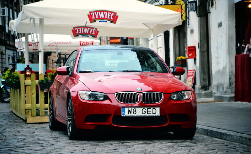 street, e, red, architecture, Cars, focus on foreground, bmw, motor vehicle, transportation, m, text, red, car, outdoors, m3, 2K, western script, land vehicle