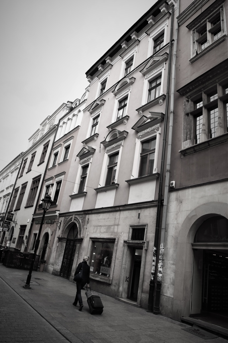 city life, one person, full length, men, real people, 5K, residential district, walking, arch, day, window, architecture, built structure, apartment, building exterior