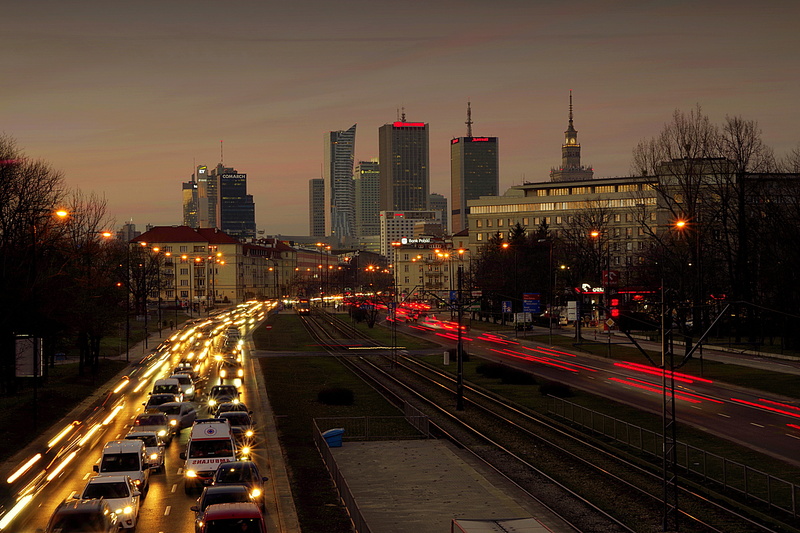 built structure, outdoors, tall - high, traffic, landscape, sky, cars, skyscrapers, road, avenue independence, the centre of, light trail, motor vehicle