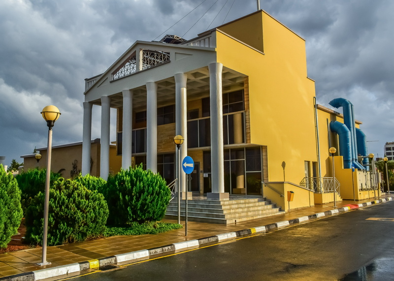 clouds, architecture, cloud - sky, sky, modern, transportation, road sign, day, street, building exterior, plant, green color, famagusta cultural centre