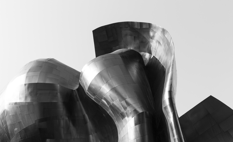 statue, experience music project, storage tank, silver colored, building exterior, no people, architectural, photography, silo, three objects, sky, business