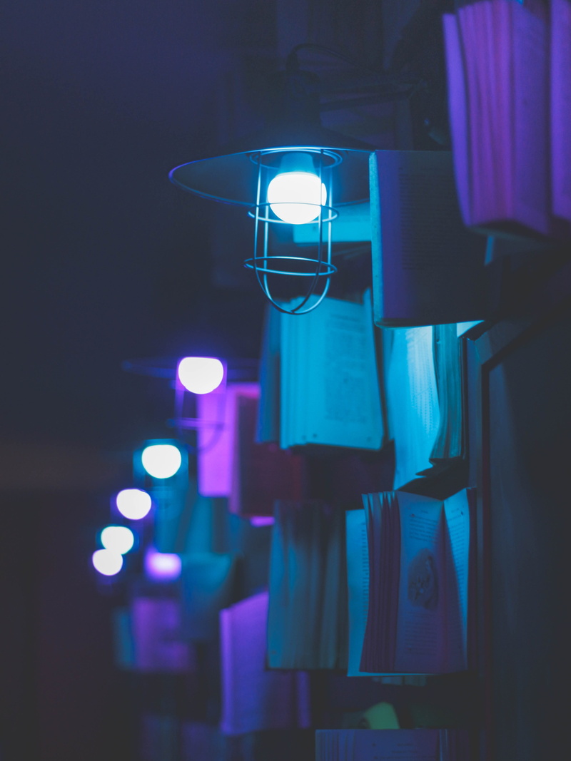 illuminated, close-up, dark, glowing, selective focus, focus on foreground, indoors, outdoor, lighting, no people, books, 4K, sconce, street, night, lighting equipment