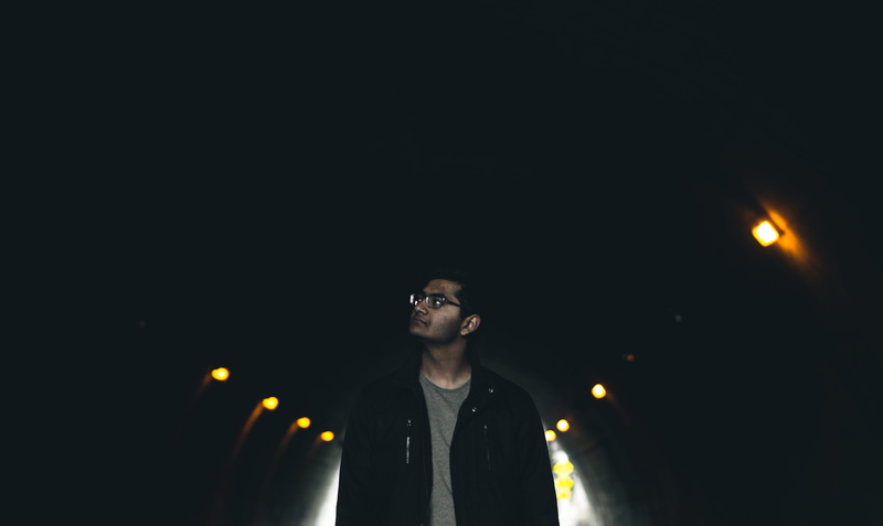 people, adult, indoors, looking, headshot, lights, contemplation, travel, man, front view, one man only, wearing, dark, black, standing, one person, night