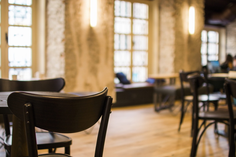table, blurry, focus, empty, business, tiled floor, blur, indoors, school, sconce, no people, wooden tables, architecture, electric lamp, chair, domestic room