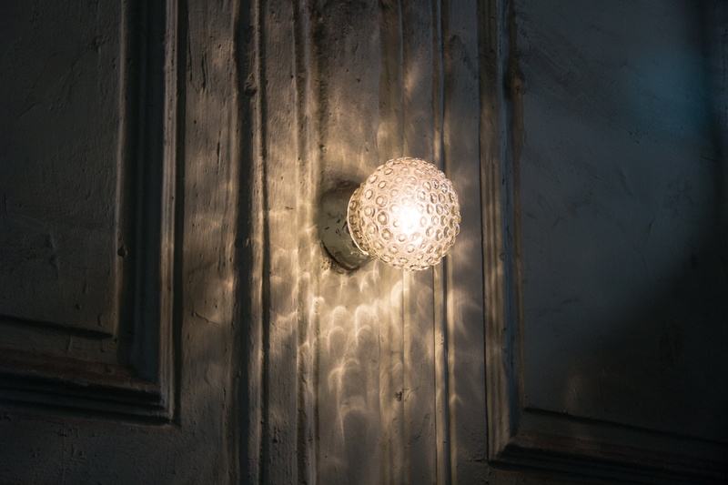 day, indoors, light - natural phenomenon, disco ball, sconce, single object, home interior, illuminated, door, lighting equipment, pattern, electric lamp