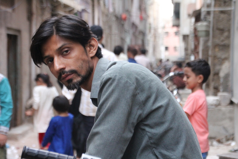 looking, real people, males, man, karachiest, young boy, contemplation, young men, incidental people, standing, portrait, black hair, beard, focus on foreground