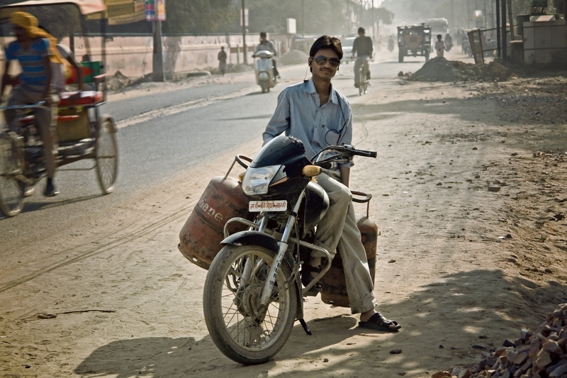 portrait, front view, land vehicle, sitting, motorcycle, gas, motor, adult, architecture, outdoors, man, summer, street, ride, 4K, person, people, city