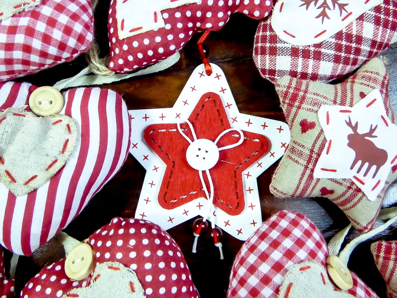 surface, toy, brown, holiday, indoors, star, orb, human representation, winter, textile, pattern, color, christmas decoration, red, art and craft, close-up