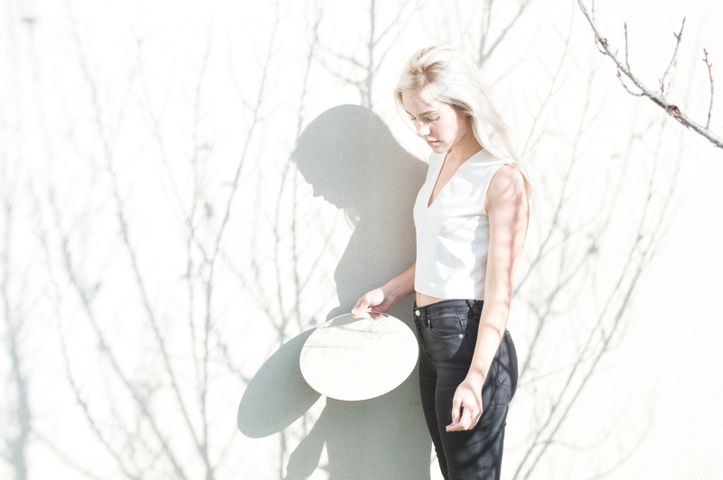 bare tree, human Age, one Person, color Image, outdoors, day, woman, tank top, three quarter length, white, sleeveless, females, image Type, one woman only
