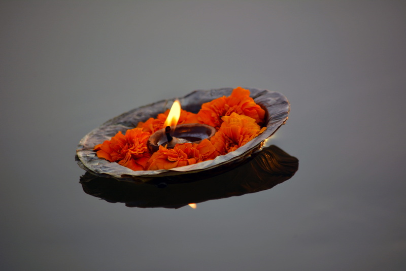 studio shot, gray background, fire - natural phenomenon, copy space, deepak, flower, river, floating, candle, freshness, gray, still life, fire, indoors