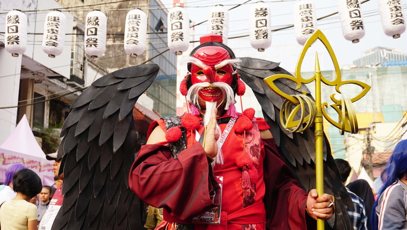 festival, traditional clothing, red, cosplay, real people, group of people, myth, built structure, day, creature, architecture, cosplayer, carnival - celebration event