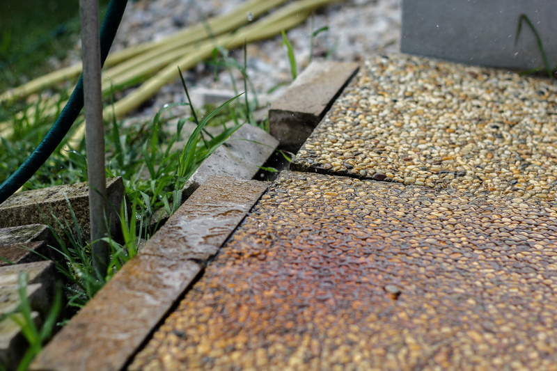 street, stone, wood - material, paving stone, plant, water droplets, nature, sunlight, city, selective focus, outdoors, mood, grass, green color, just add water