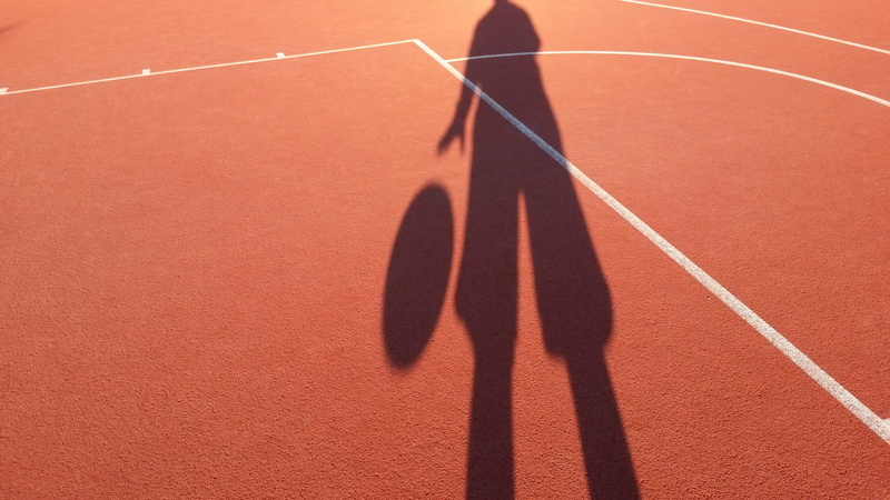 human arm, focus on shadow, shadow, court, space, arms raised, sports Race, 2K, ball, competition, body part, limb, one person, sunlight, person, track and field
