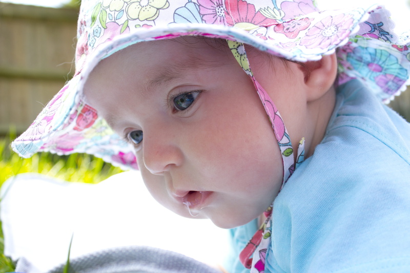 females, suckling, lifestyles, blue eyes, real people, pink color, portrait, focus on foreground, baby, headshot, day, Dribble, contemplation, floral, childhood