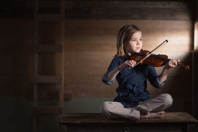 bench, full length, real people, one person, child, musician, childhood, concentration, front view, violinist, holding, sitting, arts culture and entertainment