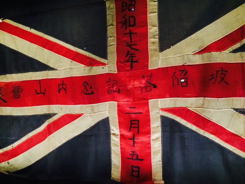 2K, close-up, japanese invasion, text, western script, guidance, no people, arrow symbol, day, war, outdoors, japanese, patriotism, architecture, english flag