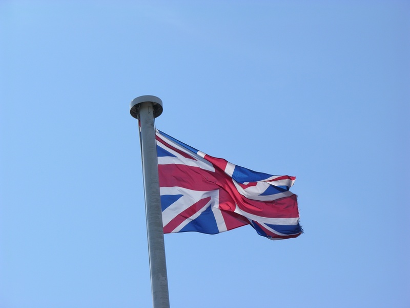 day, copy space, clear sky, england, national icon, wind, pole, patriotism, nature, blue, low angle view, striped, flag, british, national, red, waving