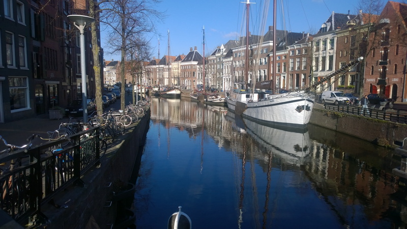 ship, architecture, water, sky, vessel, travel destinations, outdoors, row house, dutch, travel, building exterior, canal, reflection, building, boat, nautical vessel