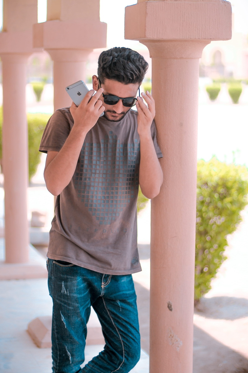 standing, young men, lifestyles, photographing, wear, hyderabad sindh, one person, man, young adult, outdoors, real people, person, pillar, guy, architectural column