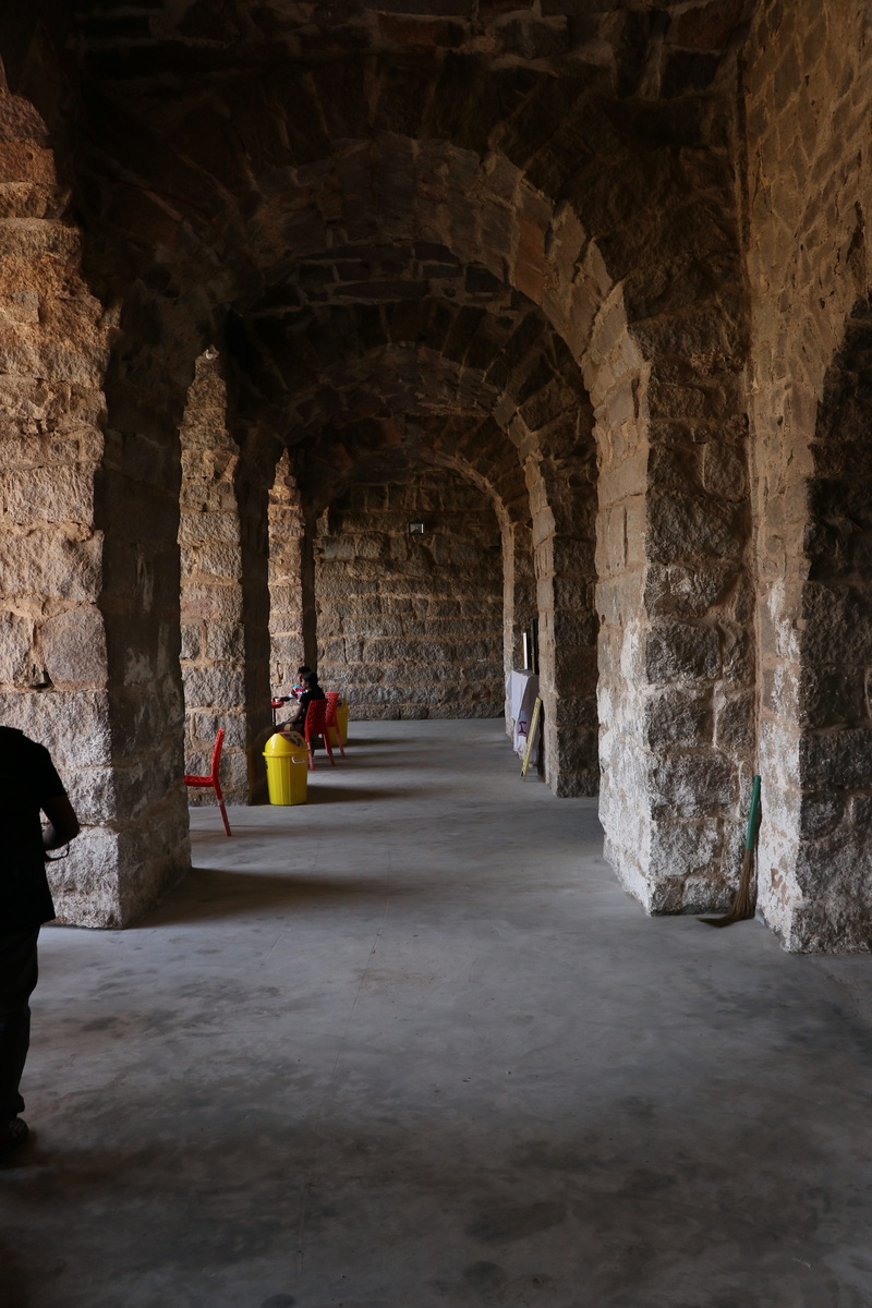 women, real people, people, the past, indoors, stone wall, 5K, lifestyles, the way forward, india, arch, building, travel, old, golconda fort, men, adult