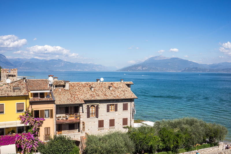 water, architecture, sirmione, lombardy, mountain range, mountains, flowering plant, plant, landscape, beauty in nature, vacation, scaliger, blue, built structure