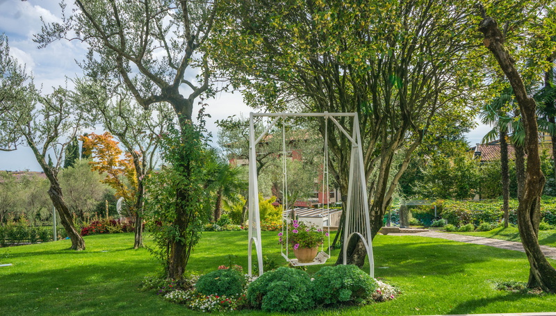 park, garden, travel, growth, sky, beauty in nature, grass, view, lake garda, sirmione, green color, plant, tree trunk, park - Man Made Space, flowers