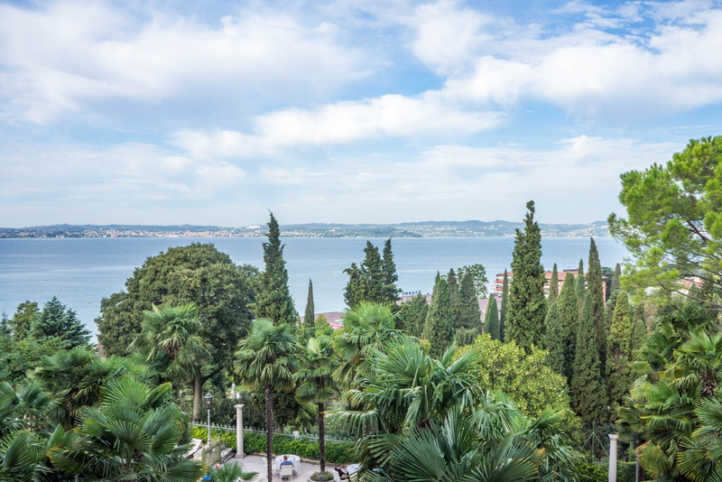 tranquil scene, lake garda, bay, water, scenics - nature, summer, outdoors, italy, tourism, beautiful landscape, tree, plant, travel, view, outdoor, sunny sky