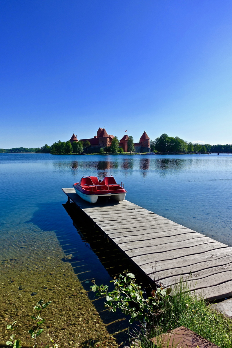 landscape, lake, water, day, plant, panorama, tranquil scene, reflection, trakai, historic, lithuania, scenics - nature, clear sky, sky, rowboat, no people