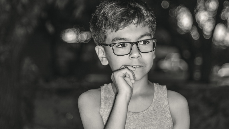 contemplation, pre-adolescent child, thinking, front view, focus on foreground, child, bokeh, real people, men, glasses, boys, males, kid, offspring, portrait