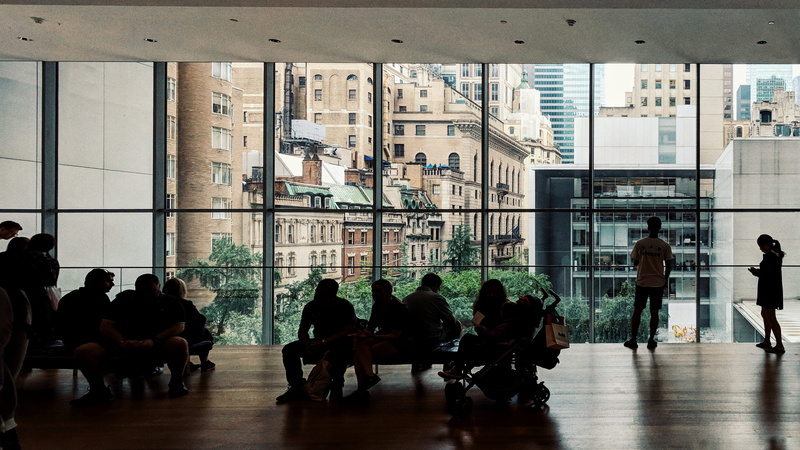 women, indoors, nyc, glass - material, lifestyles, 2K, architecture, waiting, city, day, flooring, united states, built structure, adult, new york, moma