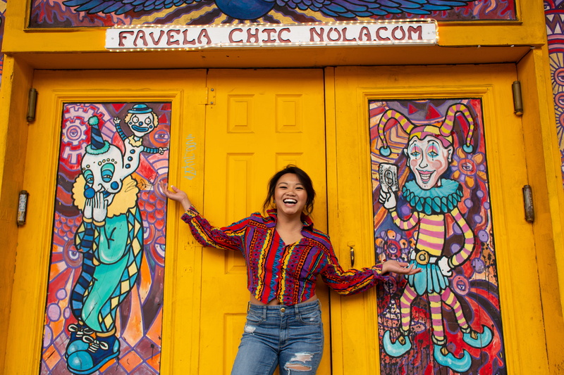 one person, happiness, day, hairstyle, chinese, 5K, portrait, door, teen, built structure, multi colored, wall - building feature, women, blonde, pants