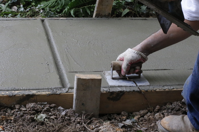 occupation, holding, equipment, retaining wall, construction, worker, employee, planes, gravel, body part, working, nature, men, human body part, sidewalk