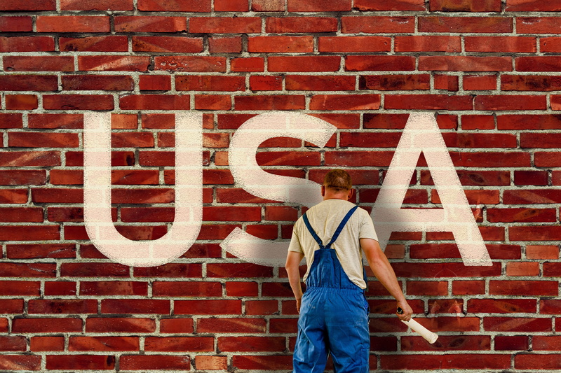 renovation, white, day, sign, brick, paint, communication, brick wall, wall - building feature, standing, usa, men, america, policy, border, rear view