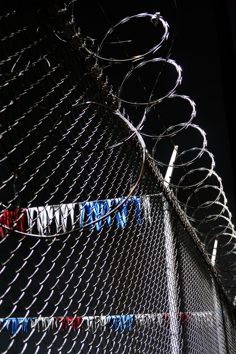 white color, communication, protection, fence, pattern, no people, hanging, low angle view, white, backgrounds, black color, border, text, border control