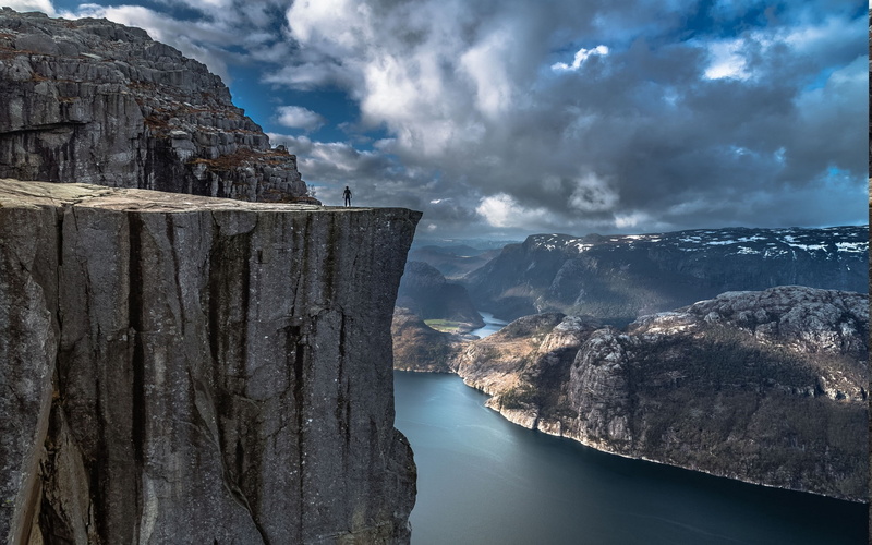 tranquil scene, mountain, beauty in nature, no people, tranquility, environment, scenics - nature, water, non-urban scene, mountain range, nature landscape fjord alone cliff mountain norway preikestolen sea rock calm water valley europe clouds