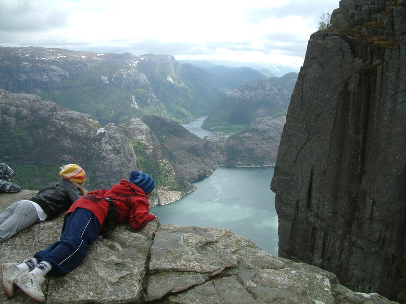 nature, body, tranquility, norway, rock - object, beauty in nature, fjord, hike, mountain, scandinavia, non-urban scene, water, clouds, outdoors, adventure