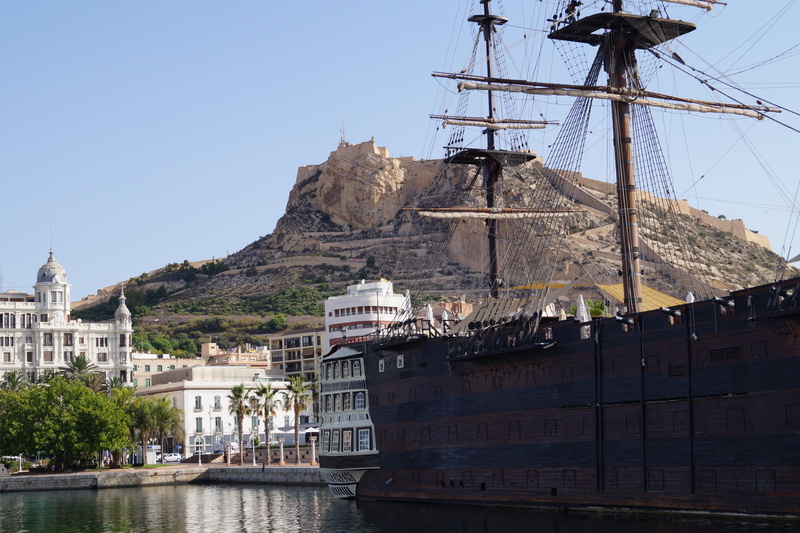 sky, spain, sea, religion, building, wooden boat, castillo de santa bárbara, holiday, travel, city, nature, outdoors, history, building exterior, nautical Vessel